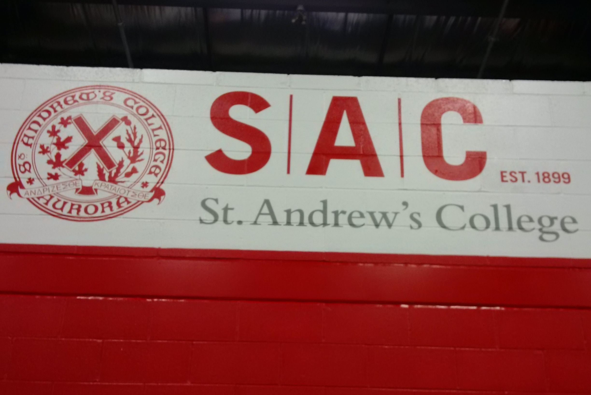 Painted logo on brick inside hockey arena