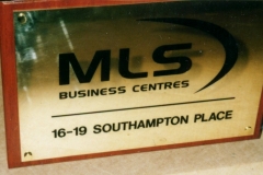 Polished brass engraved nameplate with hardwood backing board