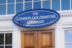 Gilded lettering on glass with wooden framed sign. Pall Mall, London 2000