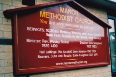 Wooden painted church sign with hand-painted lettering. London 2001