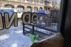 Sign painting onto inside of window