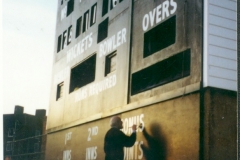 Vic hand-painting the old scoreboard at the Oval Cricket Ground, London 1998