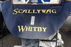 Gold leaf lettering on the Scallywag sailboat, Whitby Marina, 2021