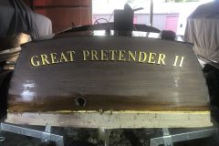 Gold leaf lettering on the Great Pretender, Muskoka, 2021